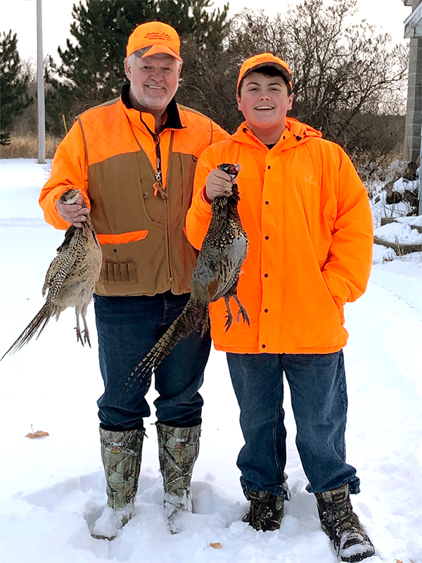 Older Gentleman and young man hunting pheasants at American Heritage Hunting Club
